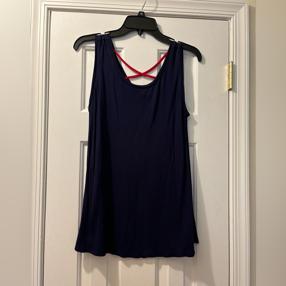 Navy sleeveless size small  top with red crisscross straps in the back